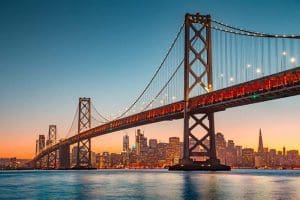 San Francisco skyline with Oakland Bay Bridge at sunset, Califor