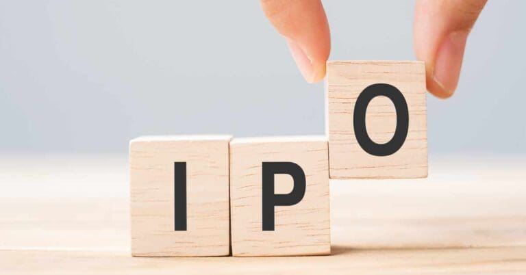 IPO (Initial Public Offering) word with wooden cube block, shares of a private corporation to the public in a new stock issuance. Stock, Fund, Investors and Investment concept